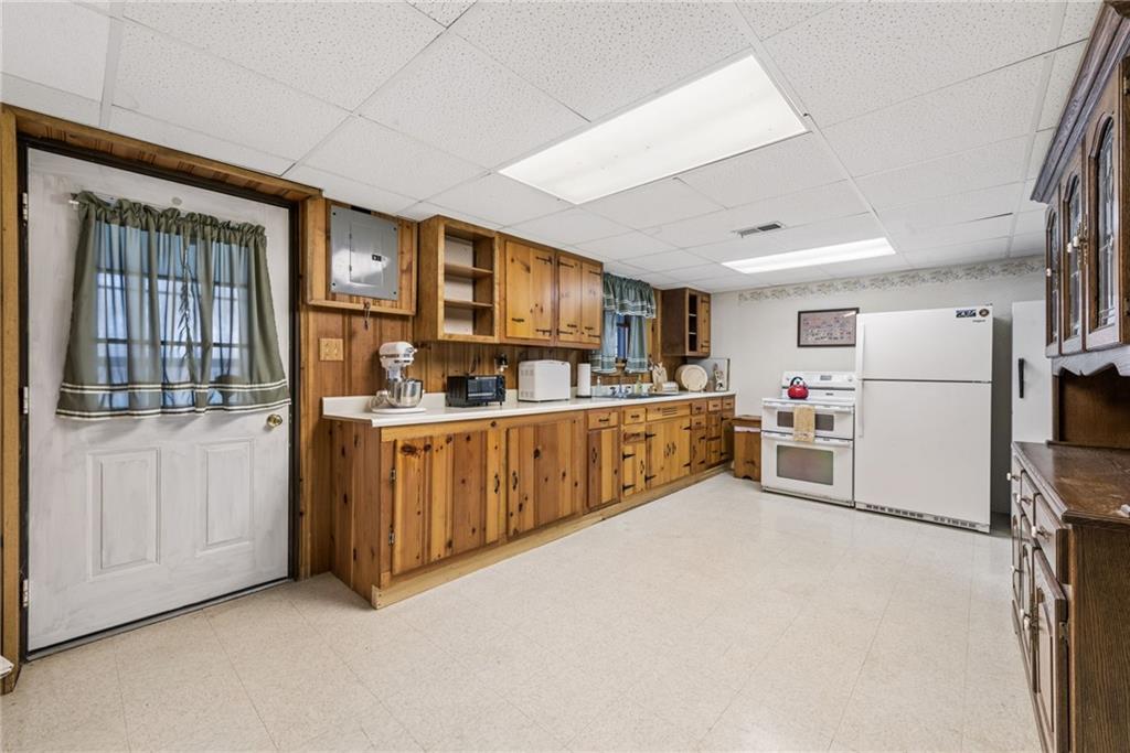 1824 Washington Road Apollo, PA 15613 - Photo 21 of 29 a kitchen with furniture a refrigerator and cabinets