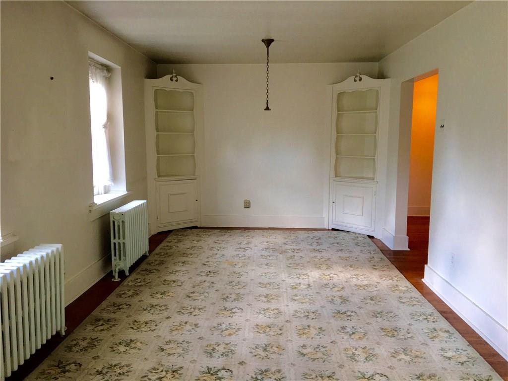113 Latrobe Steel Road Latrobe, PA 15650 - Photo 21 of 25 Large Family Room on the second Floor. Built-In Corner Shelving! The area rug has hardwood floors underneath. This room could be converted to another large Bedroom. The Hallway leads to the steps to the First Floor. Out of site is a Kitchenette/Laundry Room in the back of the adjoining Hallway.