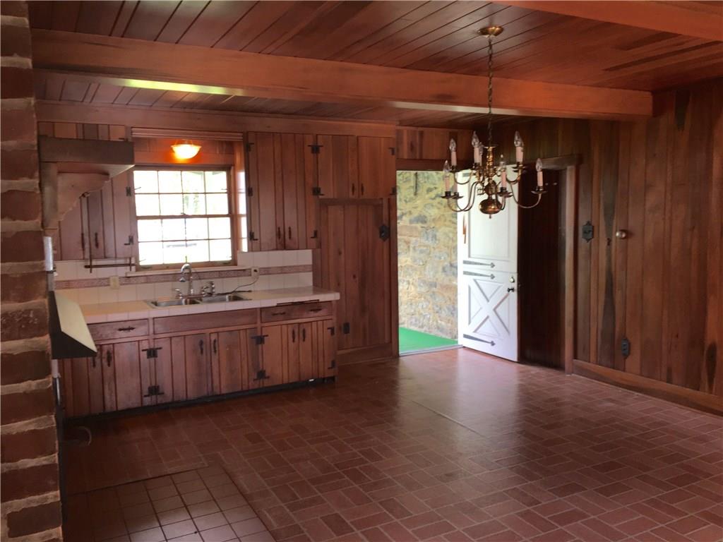 113 Latrobe Steel Road Latrobe, PA 15650 - Photo 5 of 25 Giant 16x20 Kitchen/Dining Area with a back door onto the screened in porch. Solid Cherry cabinets, walls and ceiling.