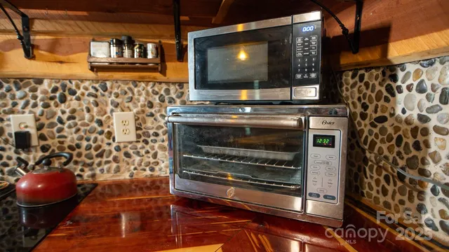 a living room with a fireplace and a flat screen tv