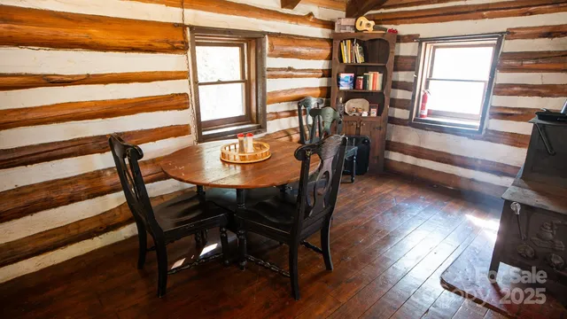 a view of a dining room with furniture and a window