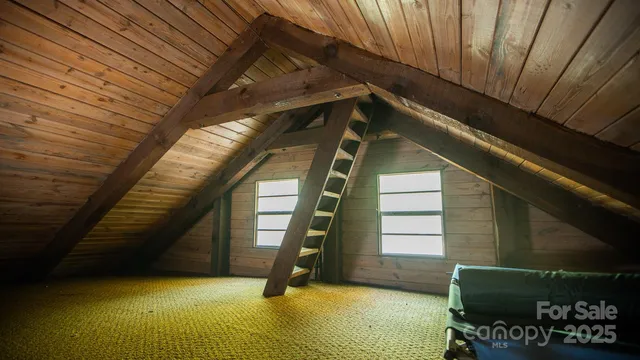 a bathroom with a shower and a window
