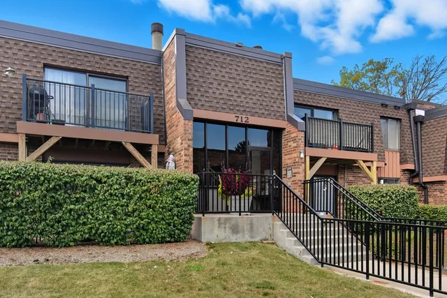 a view of a house with backyard and deck