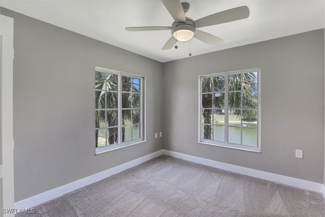 9465 Ivy Brook Run, Unit 901 Fort Myers, FL 33913 - Photo 17 of 24 an empty room with a window and a ceiling fan