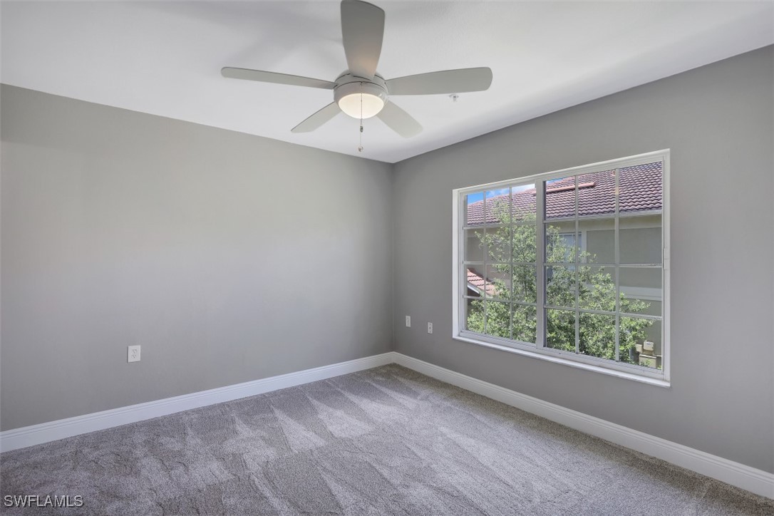 9465 Ivy Brook Run, Unit 901 Fort Myers, FL 33913 - Photo 18 of 24 an empty room with a window