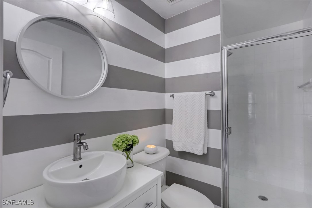 9465 Ivy Brook Run, Unit 901 Fort Myers, FL 33913 - Photo 19 of 24 a bathroom with a sink toilet and shower