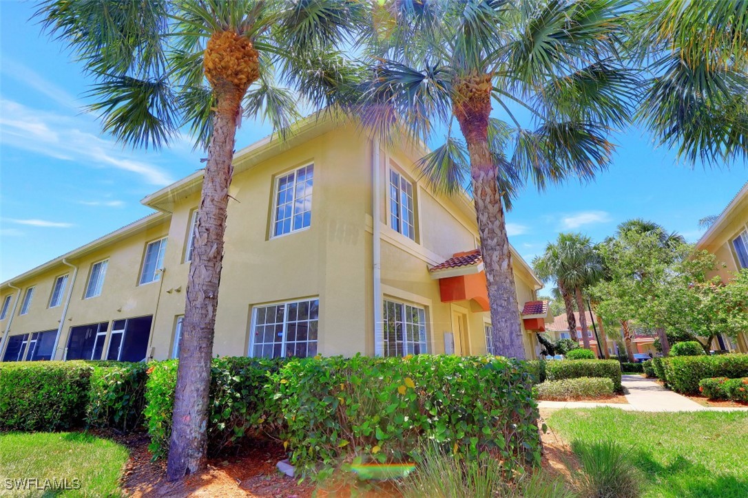 9465 Ivy Brook Run, Unit 901 Fort Myers, FL 33913 - Photo 22 of 24 a view of a palm trees front of house
