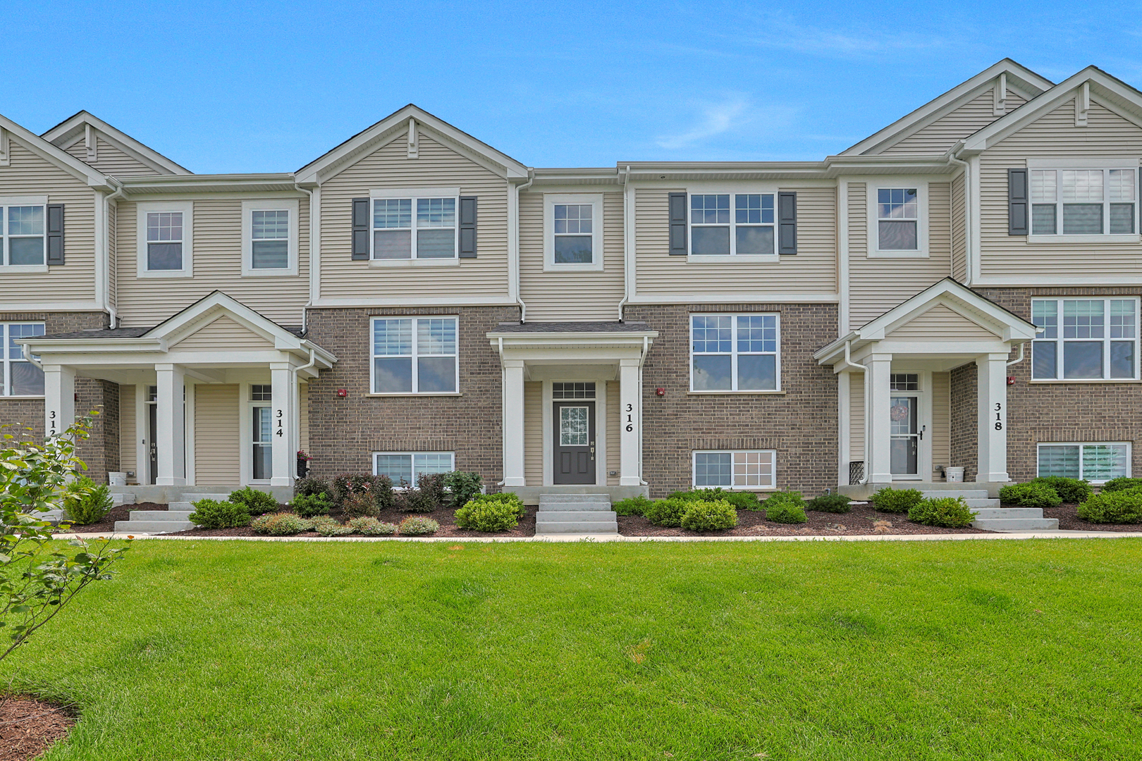 316 Timberleaf Circle Roselle, IL 60172 - Photo 1 of 37 a front view of a house with a yard and trees