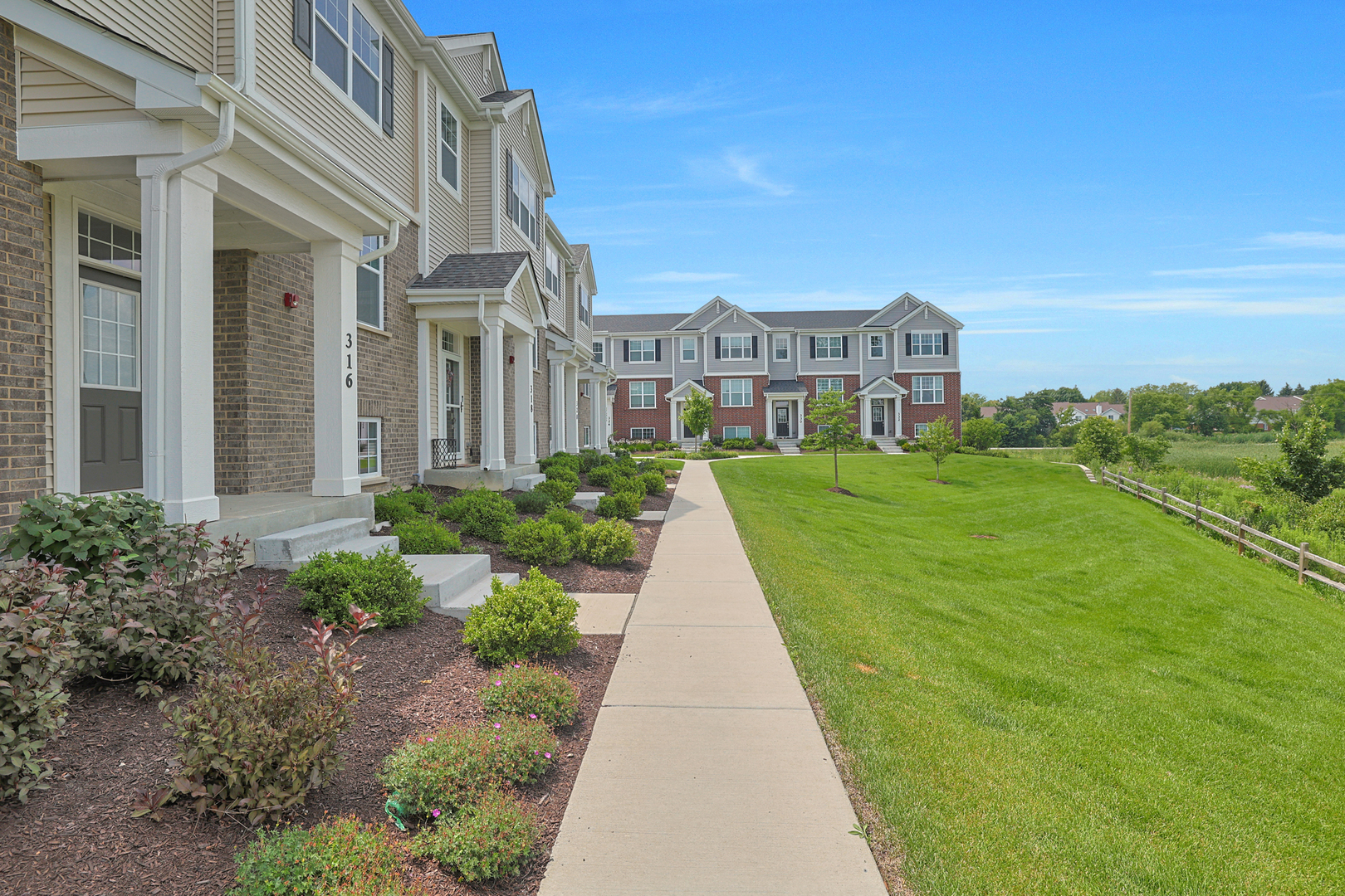 316 Timberleaf Circle Roselle, IL 60172 - Photo 2 of 37 a view of a brick house with a yard