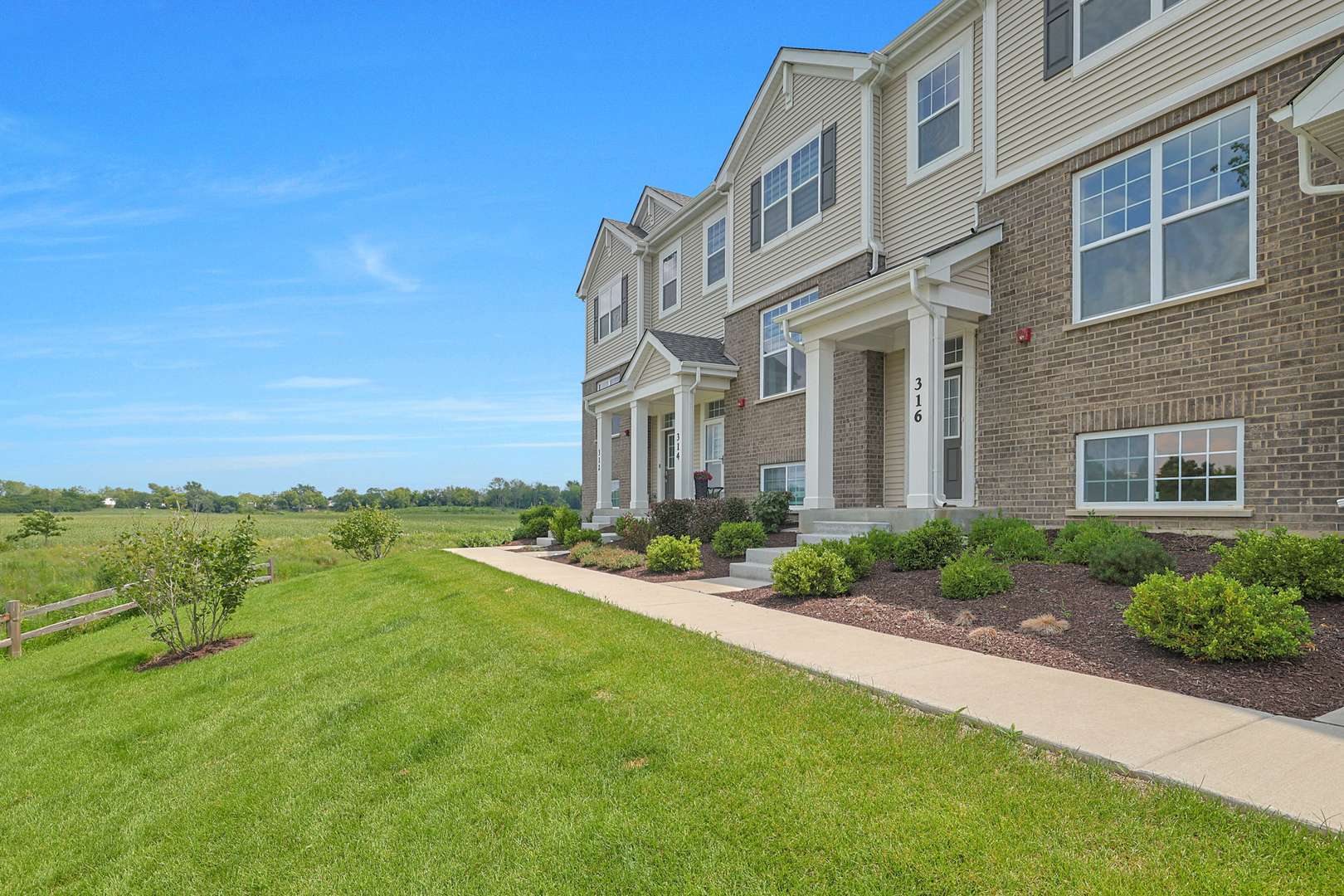 316 Timberleaf Circle Roselle, IL 60172 - Photo 3 of 37 a view of a house with a yard and potted plants
