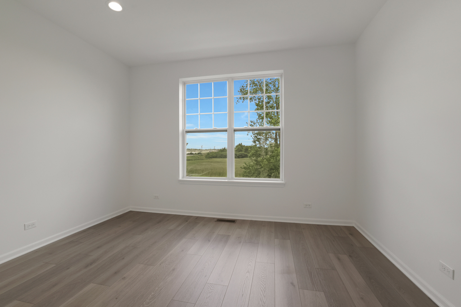 316 Timberleaf Circle Roselle, IL 60172 - Photo 8 of 37 an empty room with wooden floor and windows