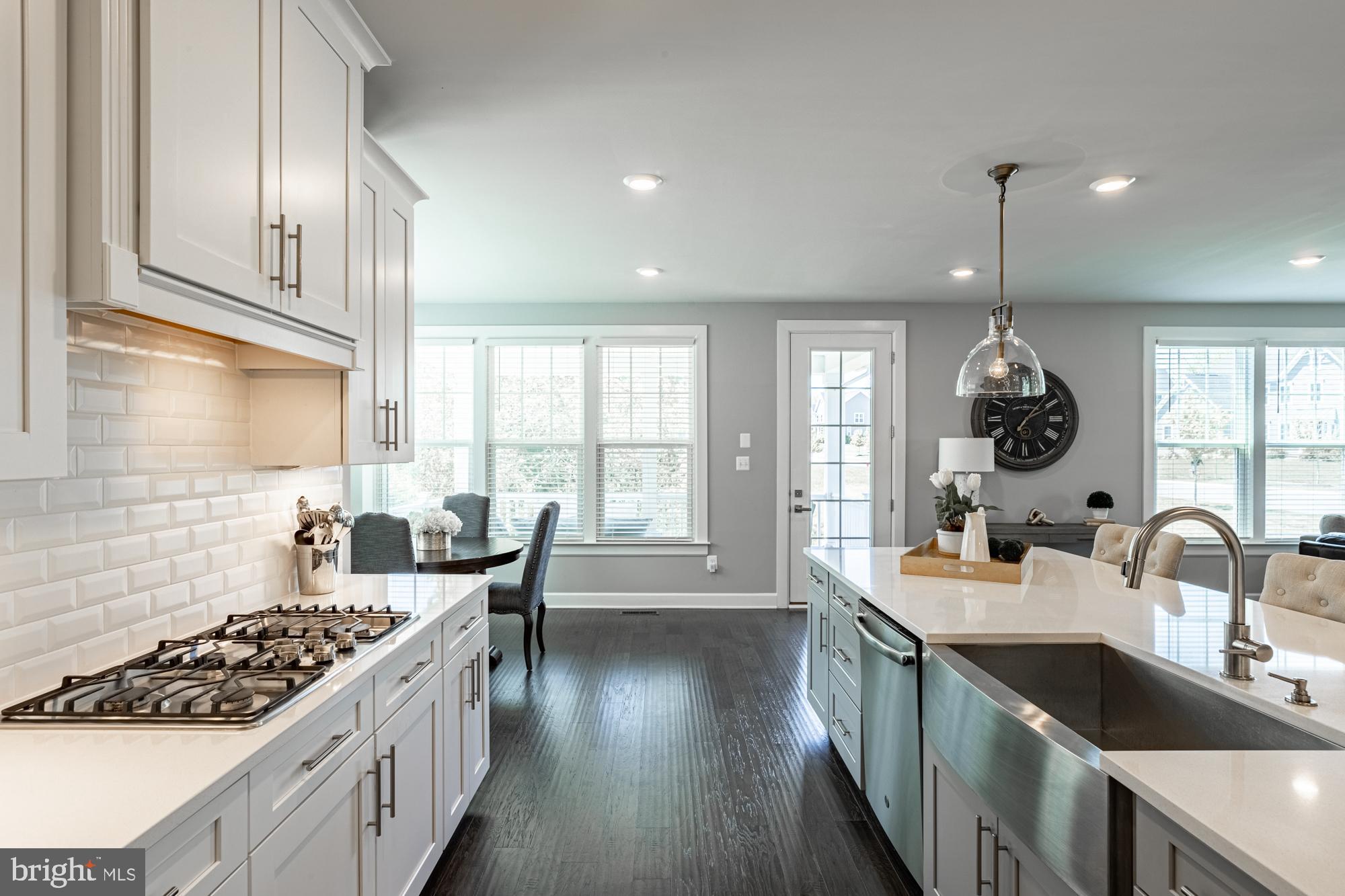 23597 Amesfield Place Aldie, VA 20105 - Photo 12 of 78 Gas cooktop with hood