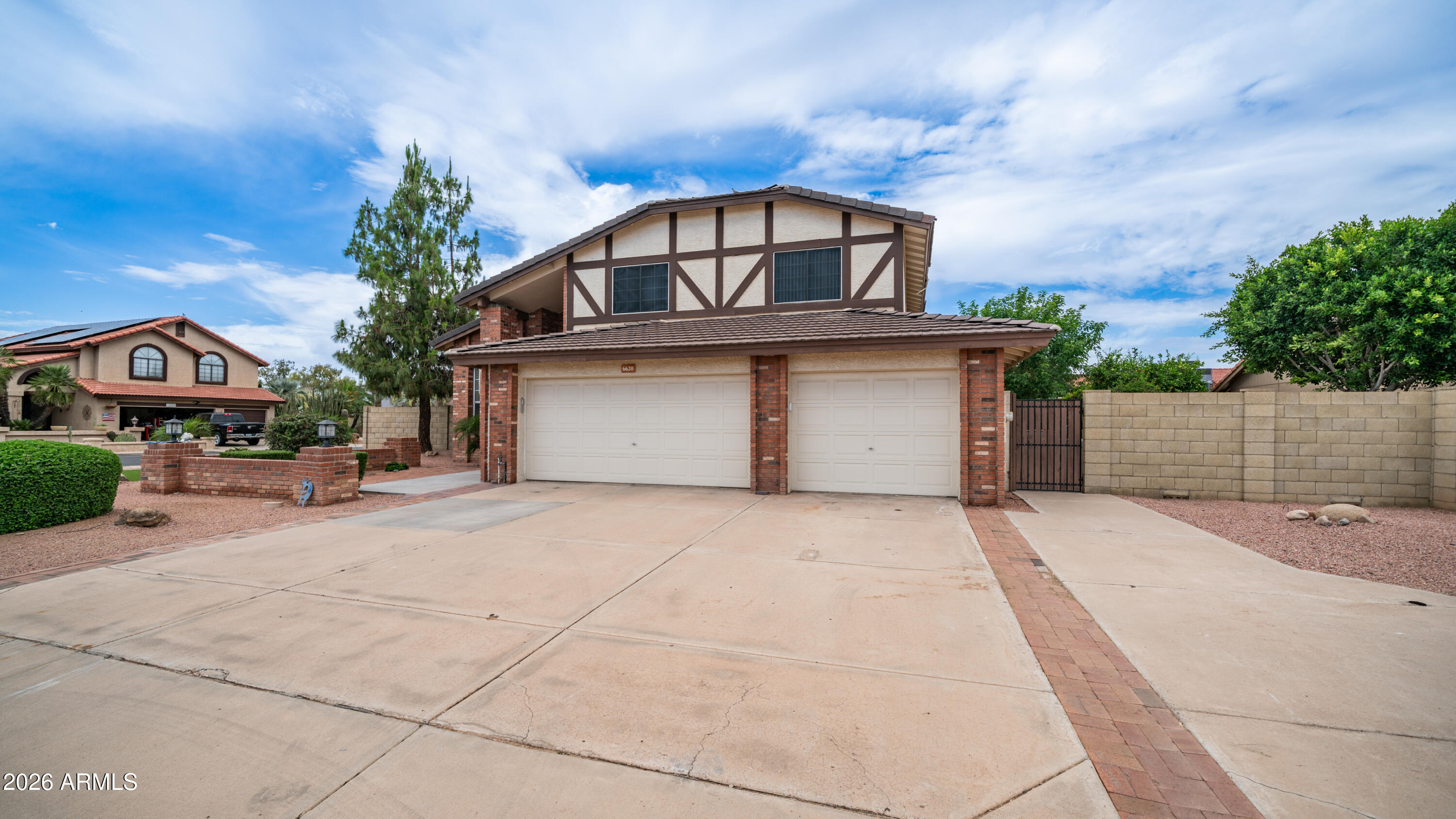 6620 West Redfield Road Glendale, AZ 85306 - Photo 32 of 33 a front view of a house with a yard and garage
