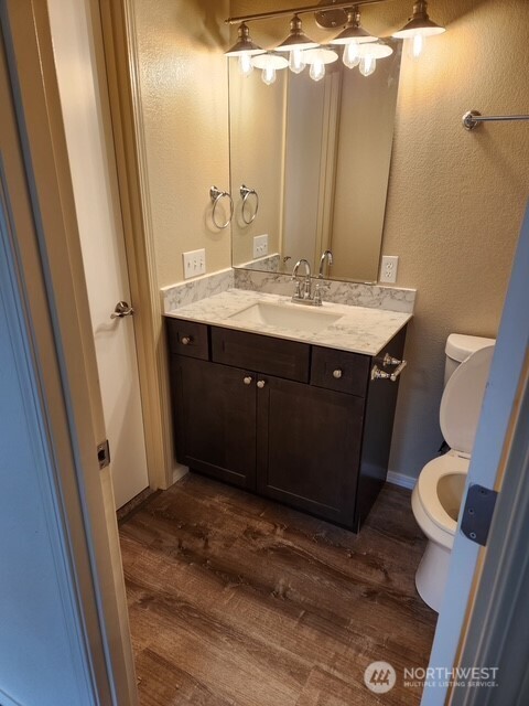 12303 Alexander Road Everett, WA 98204 - Photo 18 of 19 a bathroom with a sink vanity mirror and toilet