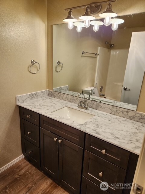 12303 Alexander Road Everett, WA 98204 - Photo 19 of 19 a bathroom with a granite countertop sink and a mirror