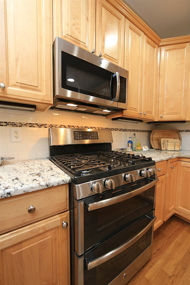 5208 Strathmore Drive Raleigh, NC 27613 - Photo 15 of 30 Enjoy the speed of cooking with gas & a micro-wave Gas Stove