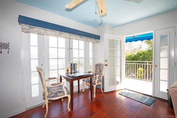 a workspace with wooden floor and furniture