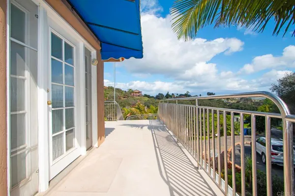 a view of balcony with furniture