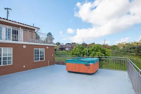 a view of a house with pool and a yard