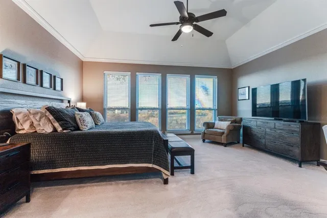 a living room with furniture ceiling fan and a window