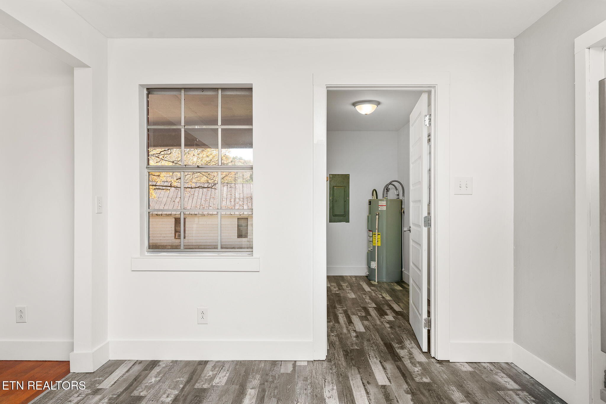 287 Watson Avenue Spring City, TN 37381 - Photo 13 of 24 a view of a hallway with a wooden floor