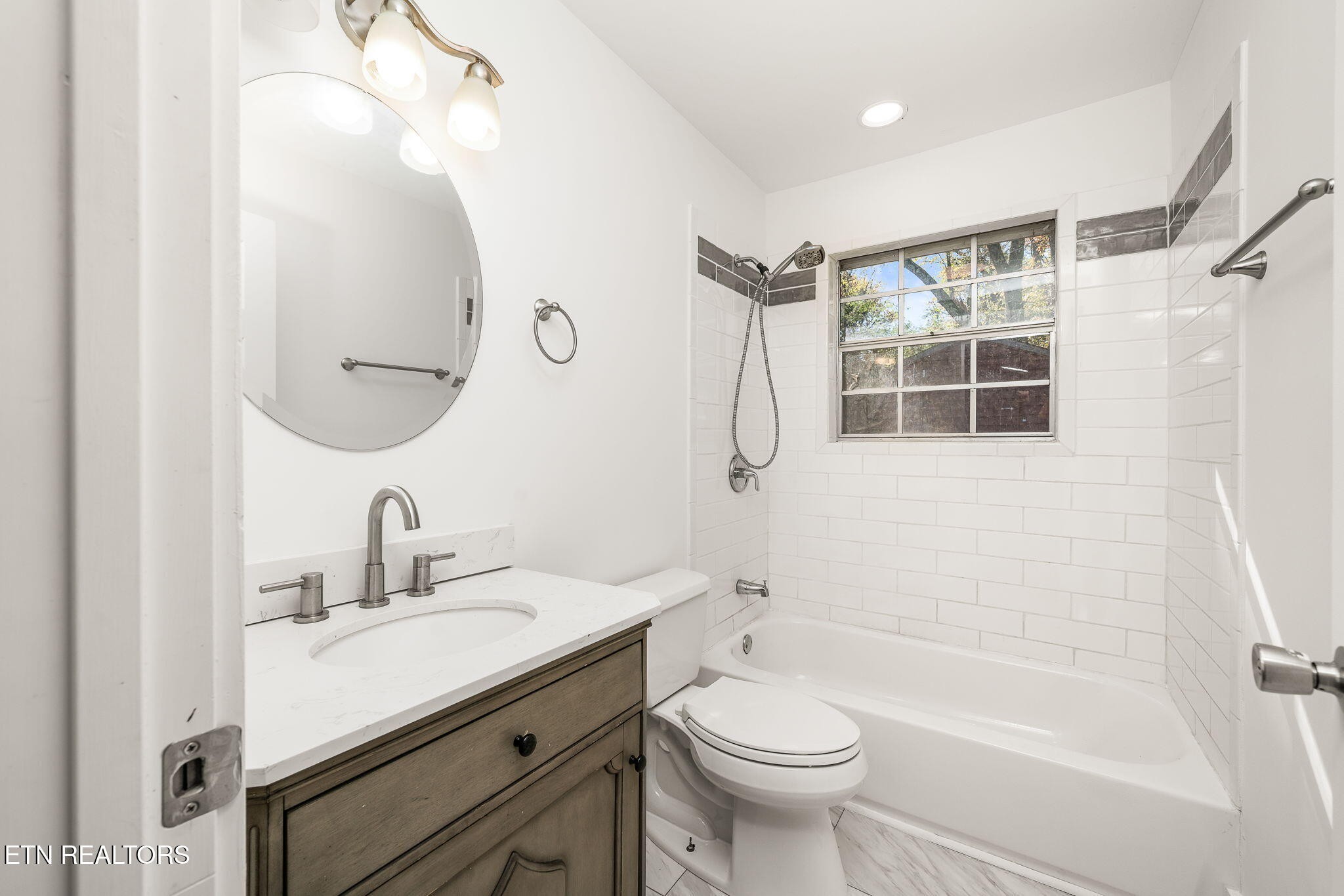 287 Watson Avenue Spring City, TN 37381 - Photo 19 of 24 a bathroom with a sink a toilet and shower