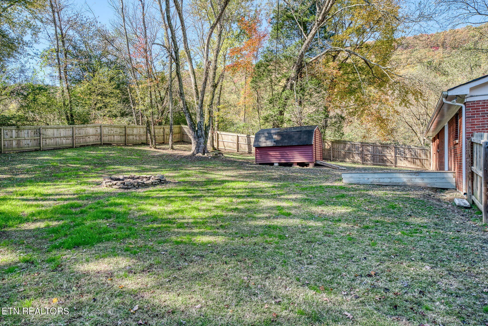 287 Watson Avenue Spring City, TN 37381 - Photo 22 of 24 a view of a house with a yard