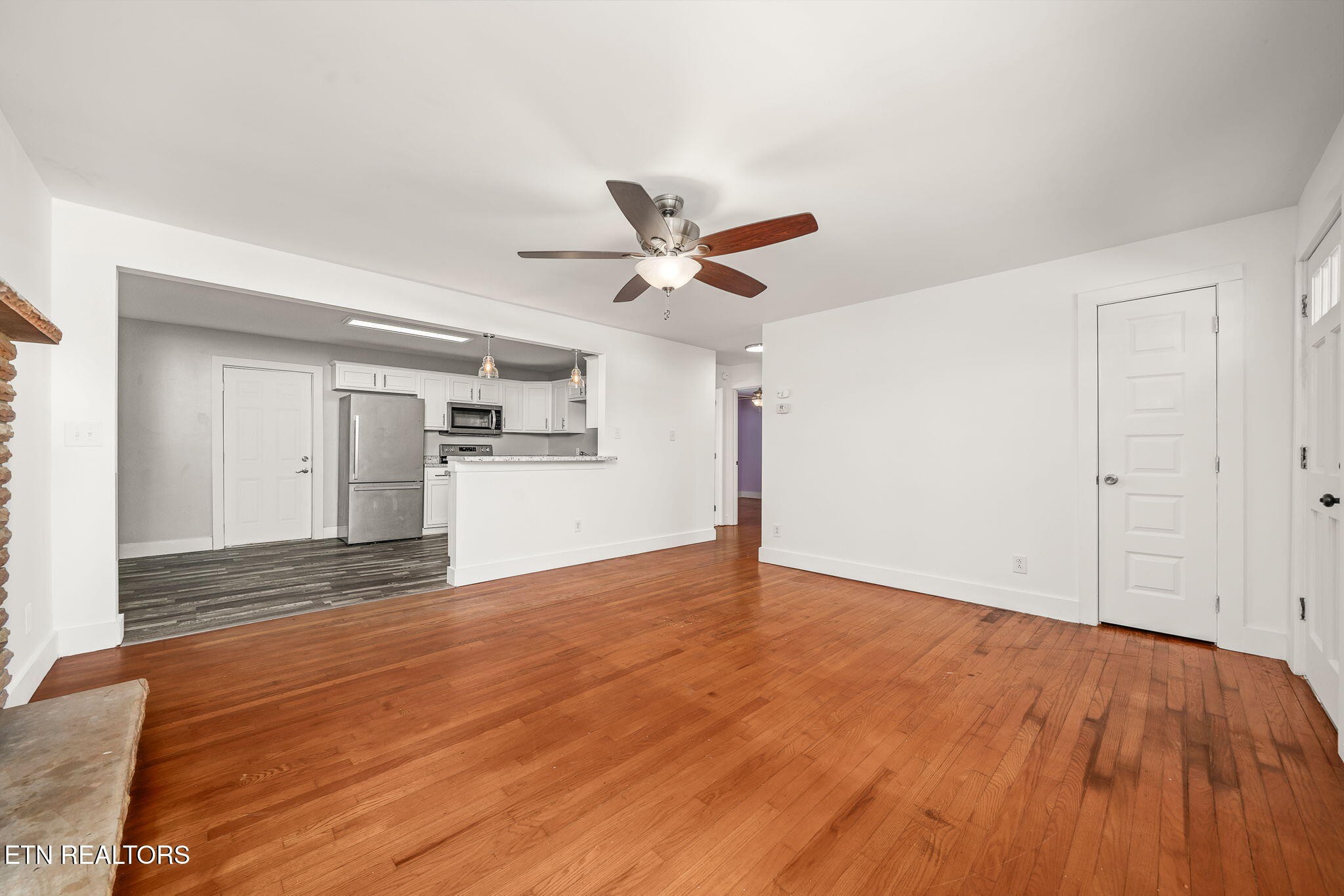 287 Watson Avenue Spring City, TN 37381 - Photo 10 of 24 a view of empty room with wooden floor and ceiling fan
