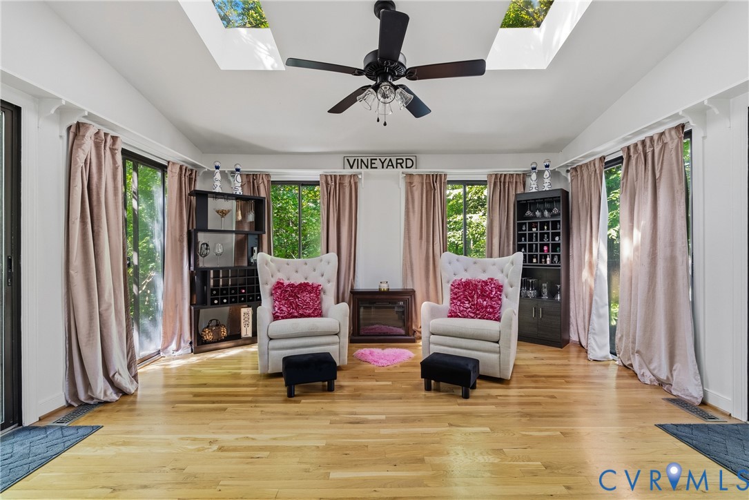 14321 Crossings Ridge Drive Midlothian, VA 23113 - Photo 22 of 43 a living room with fireplace furniture and a large window