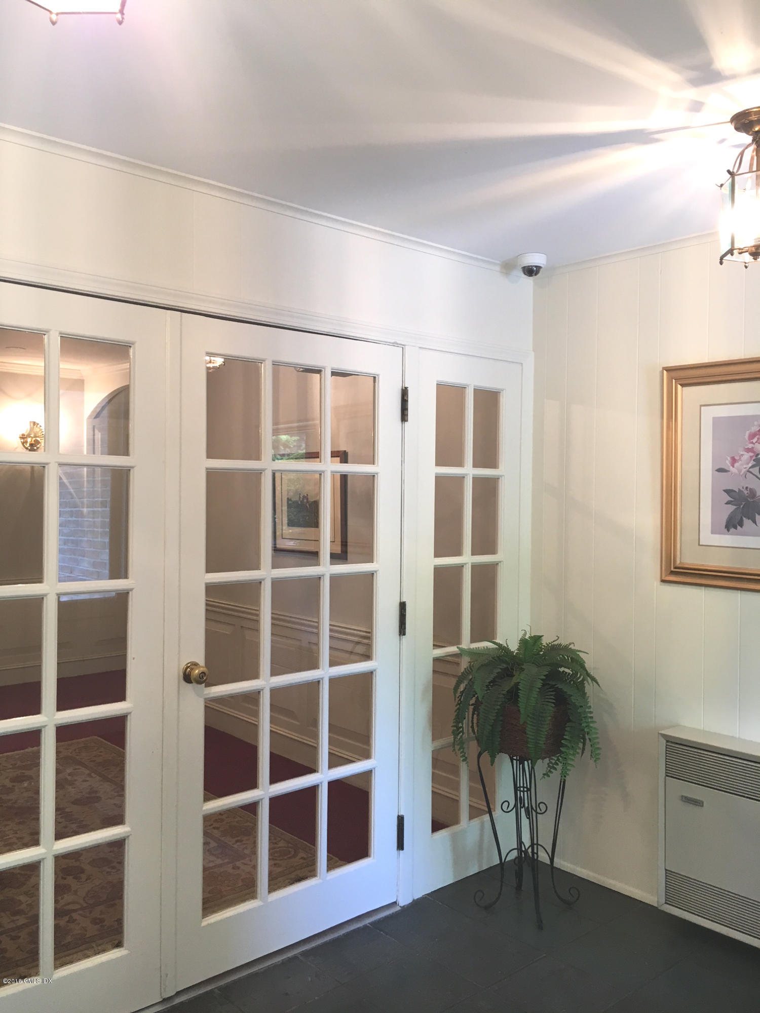 140 Field Point Road, Unit 2 Greenwich, CT 06830 - Photo 2 of 14 a view of a livingroom with furniture and windows