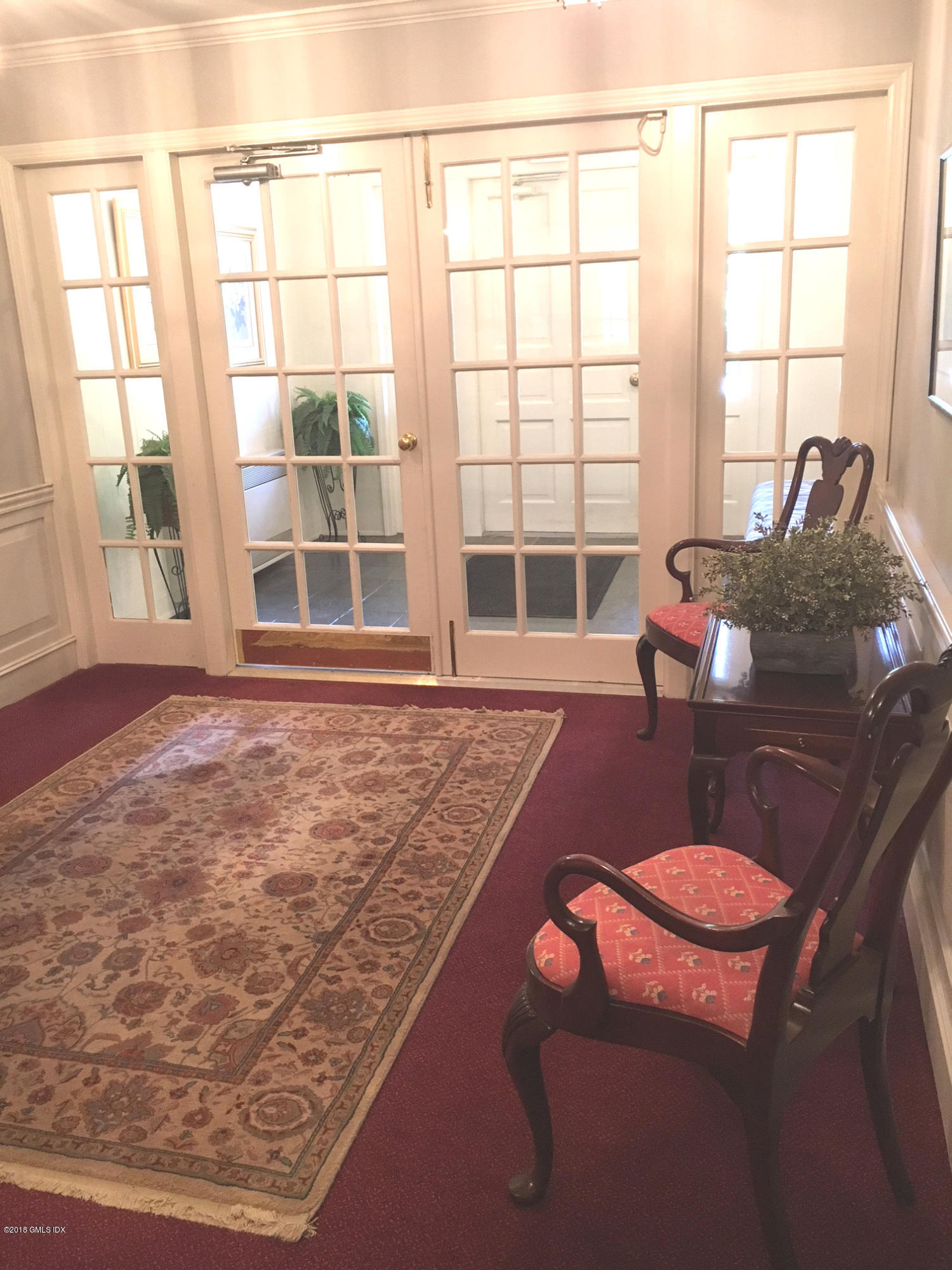 140 Field Point Road, Unit 2 Greenwich, CT 06830 - Photo 3 of 14 a living room with furniture and a window