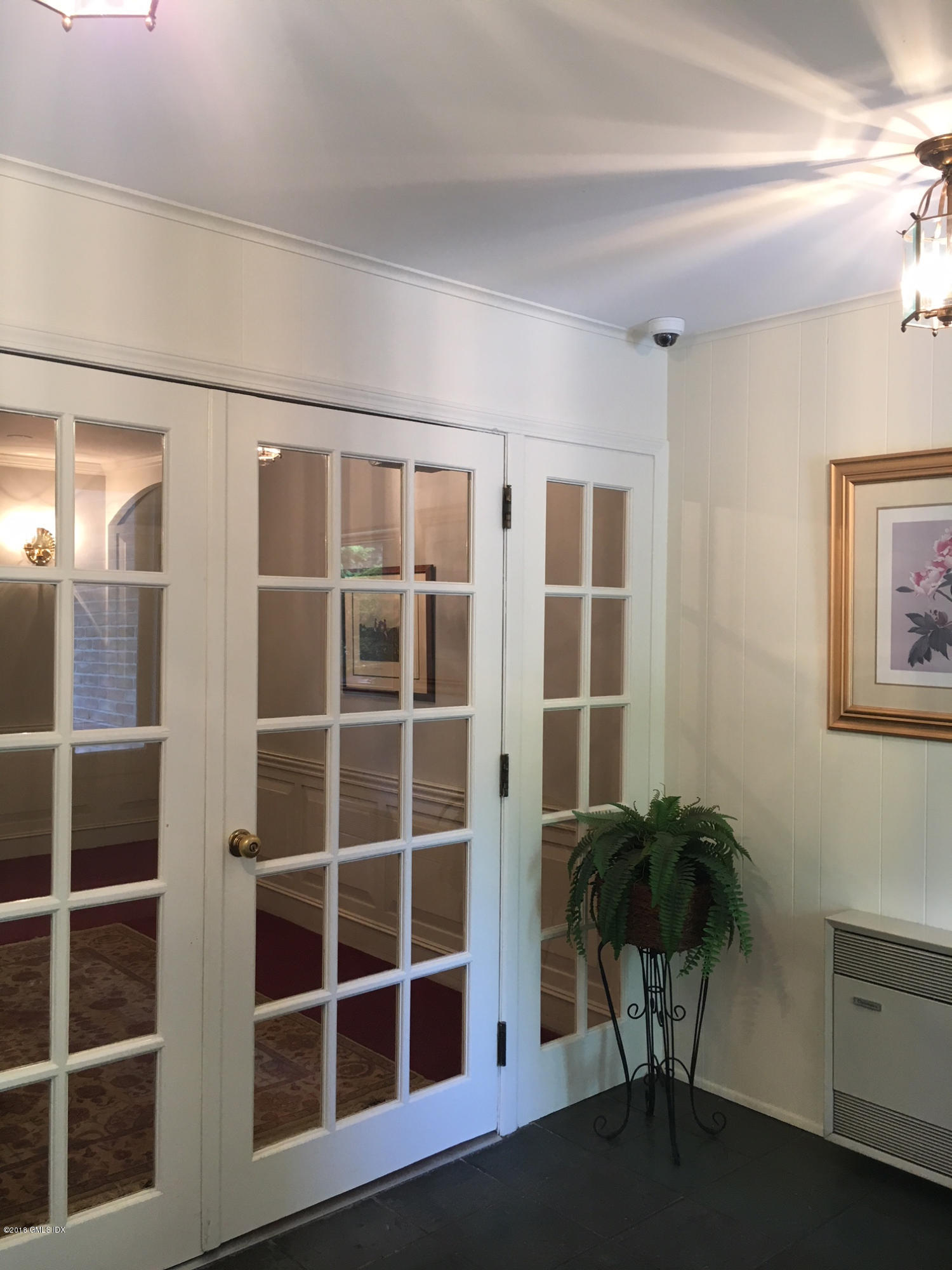 140 Field Point Road, Unit 2 Greenwich, CT 06830 - Photo 4 of 14 a view of a livingroom with furniture and window