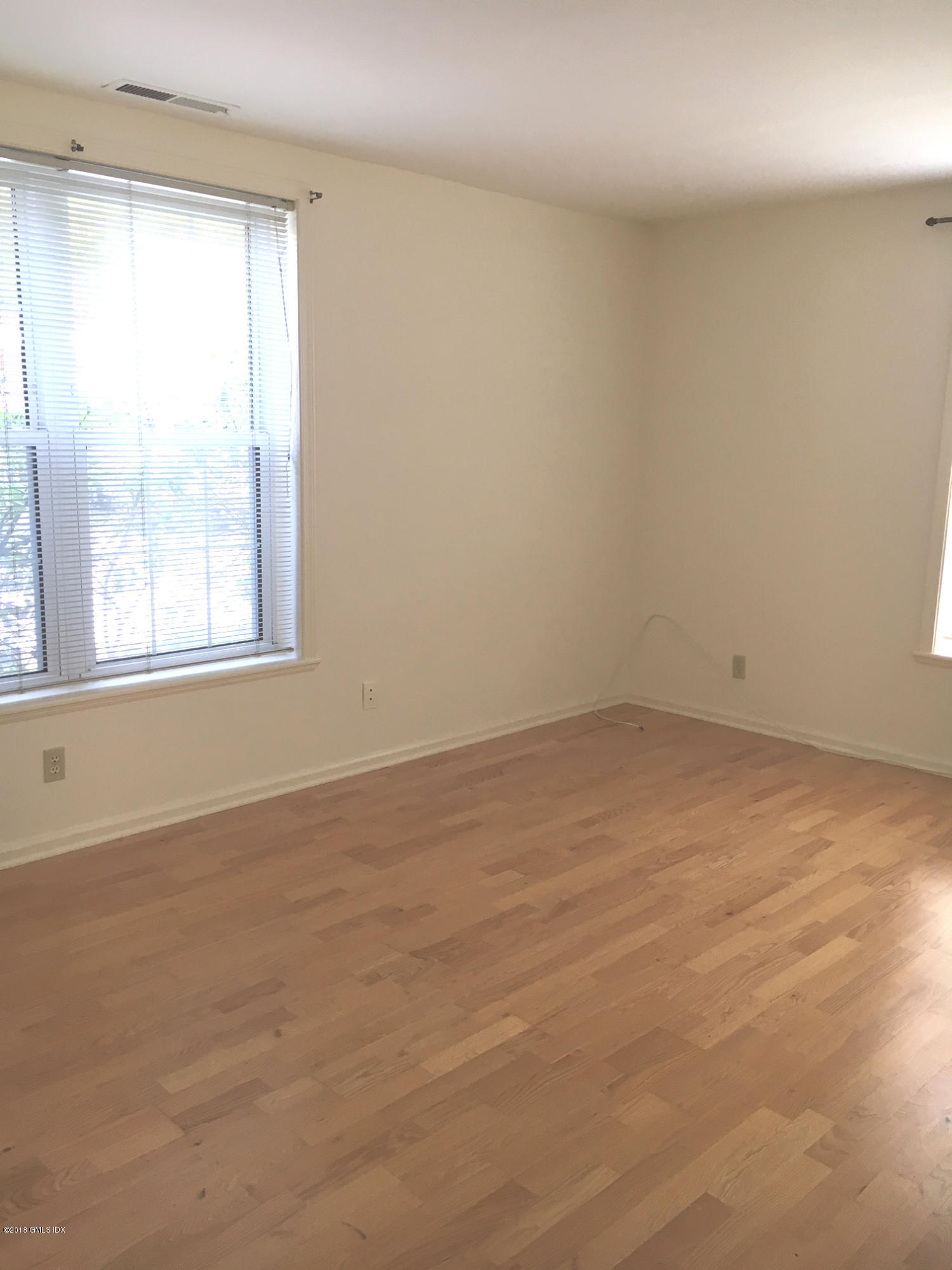 140 Field Point Road, Unit 2 Greenwich, CT 06830 - Photo 8 of 14 an empty room with a window