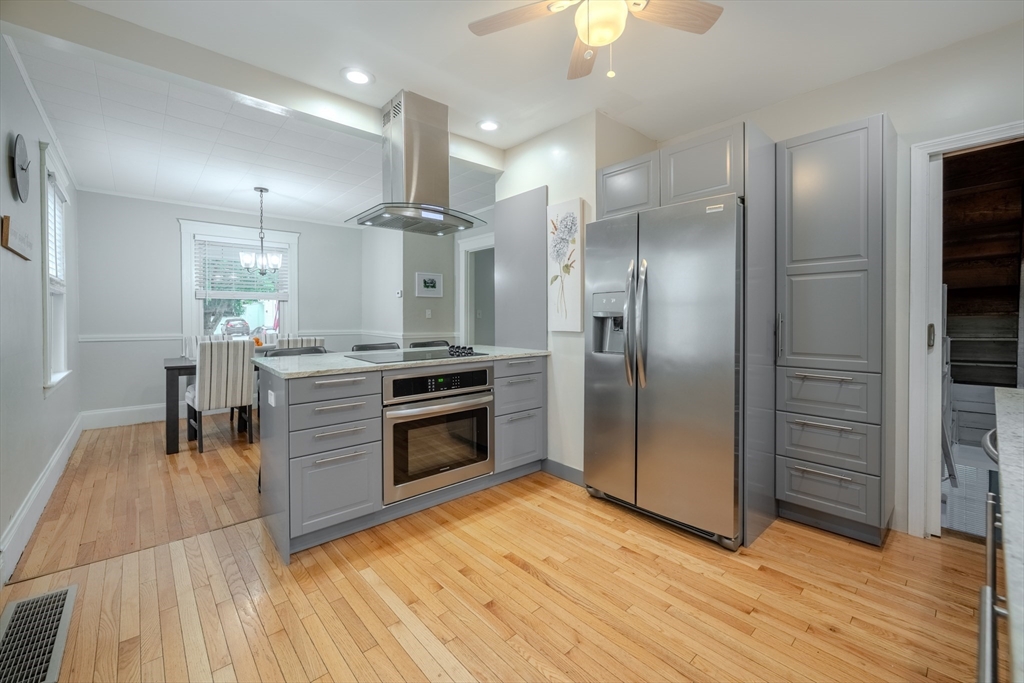 35 Lindenwood Road Stoneham, MA 02180 - Photo 14 of 37 a kitchen with stainless steel appliances granite countertop a refrigerator a sink and a stove