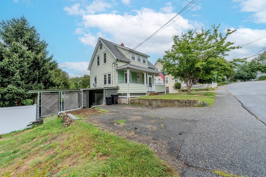 35 Lindenwood Road Stoneham, MA 02180 - Photo 2 of 37 a front view of a house with a yard and garage