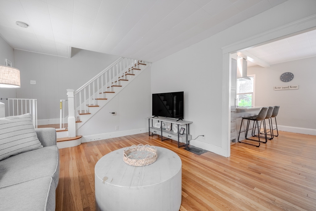 35 Lindenwood Road Stoneham, MA 02180 - Photo 7 of 37 a living room with furniture and a flat screen tv