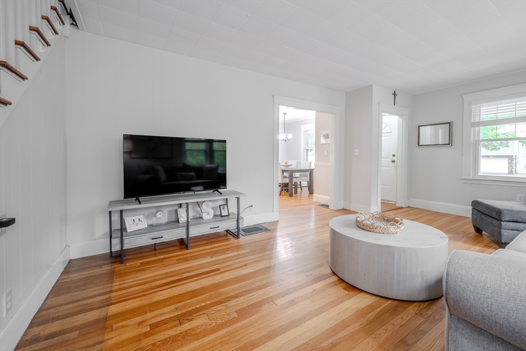 35 Lindenwood Road Stoneham, MA 02180 - Photo 8 of 37 a living room with furniture and a flat screen tv