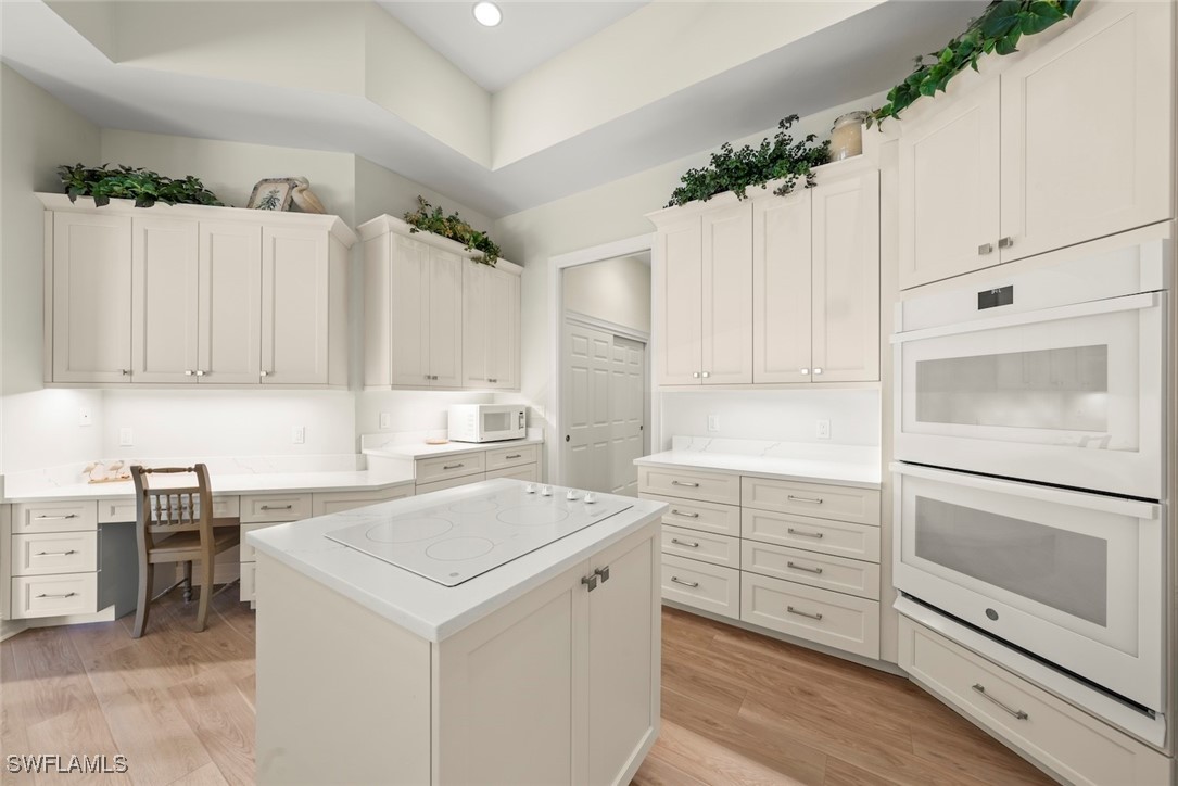 2337 Wulfert Road Sanibel, FL 33957 - Photo 12 of 45 a view of cabinets with wooden floor