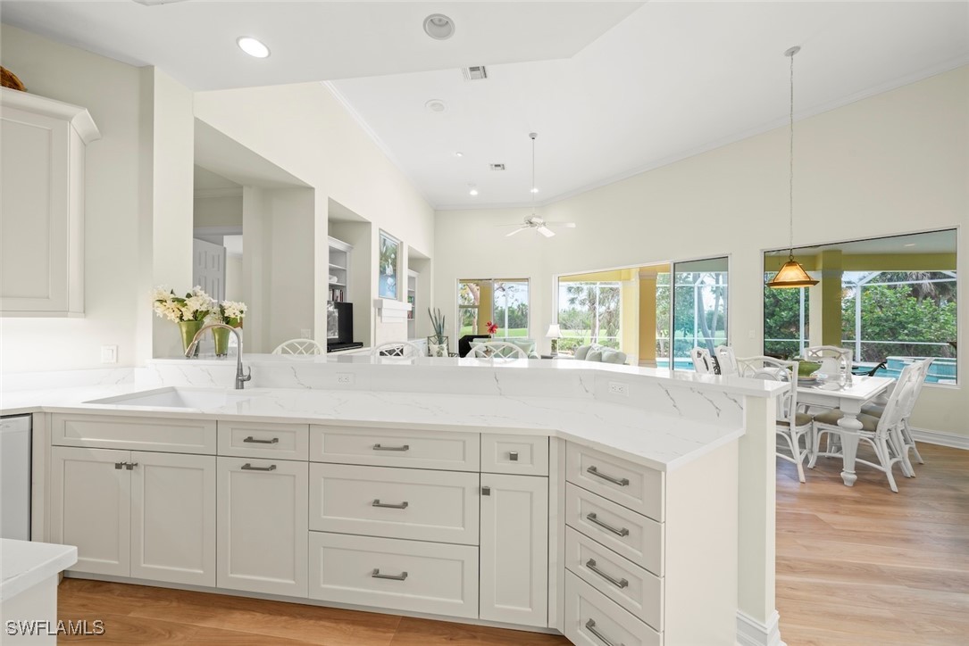 2337 Wulfert Road Sanibel, FL 33957 - Photo 13 of 45 a living room with white cabinets and wooden floor
