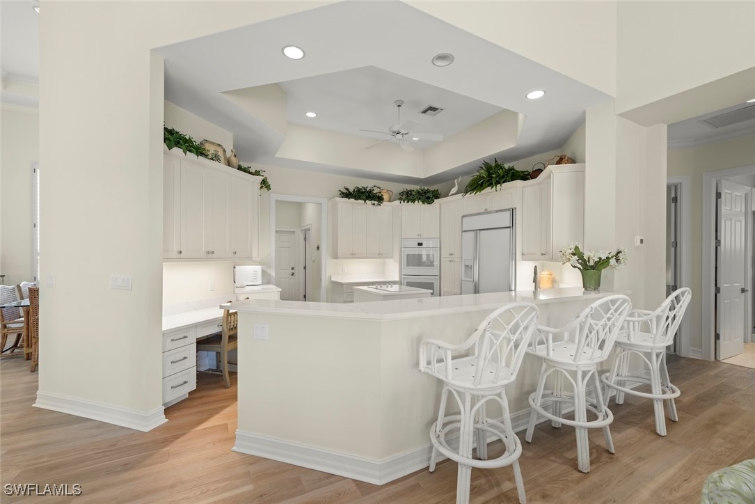 2337 Wulfert Road Sanibel, FL 33957 - Photo 14 of 45 a large kitchen with a table and chairs