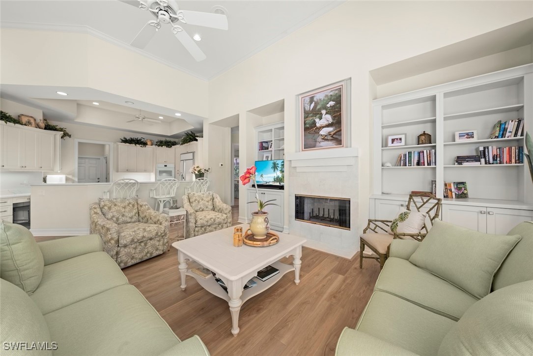 2337 Wulfert Road Sanibel, FL 33957 - Photo 18 of 45 a living room with furniture and a fireplace