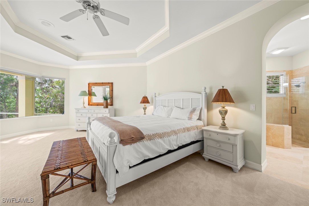 2337 Wulfert Road Sanibel, FL 33957 - Photo 20 of 45 a bedroom with a bed a table and chair