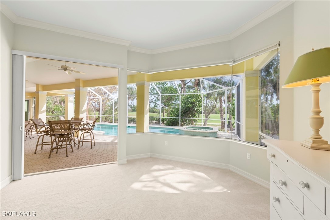 2337 Wulfert Road Sanibel, FL 33957 - Photo 22 of 45 a view of a large swimming pool and a large window