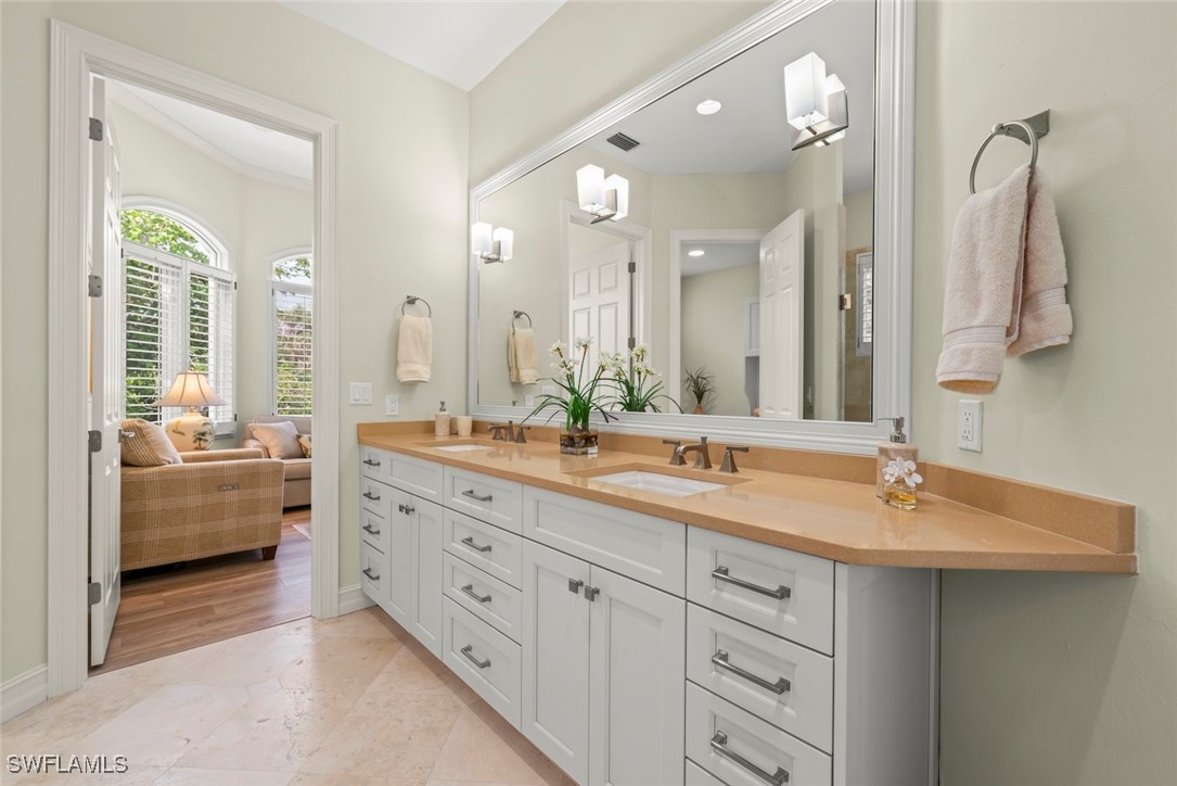 2337 Wulfert Road Sanibel, FL 33957 - Photo 24 of 45 a spacious bathroom with a double vanity sink mirror and bathtub