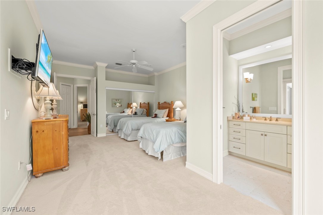 2337 Wulfert Road Sanibel, FL 33957 - Photo 28 of 45 a bedroom with a bed and a couch