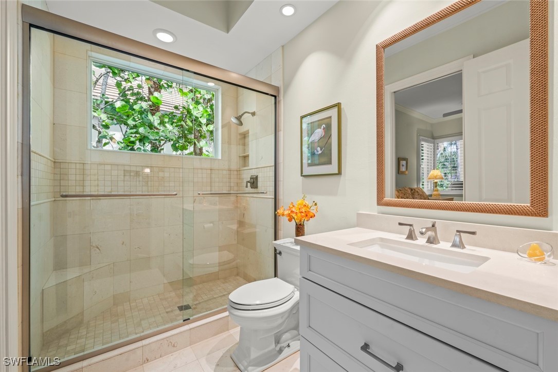 2337 Wulfert Road Sanibel, FL 33957 - Photo 29 of 45 a bathroom with a sink a toilet and shower