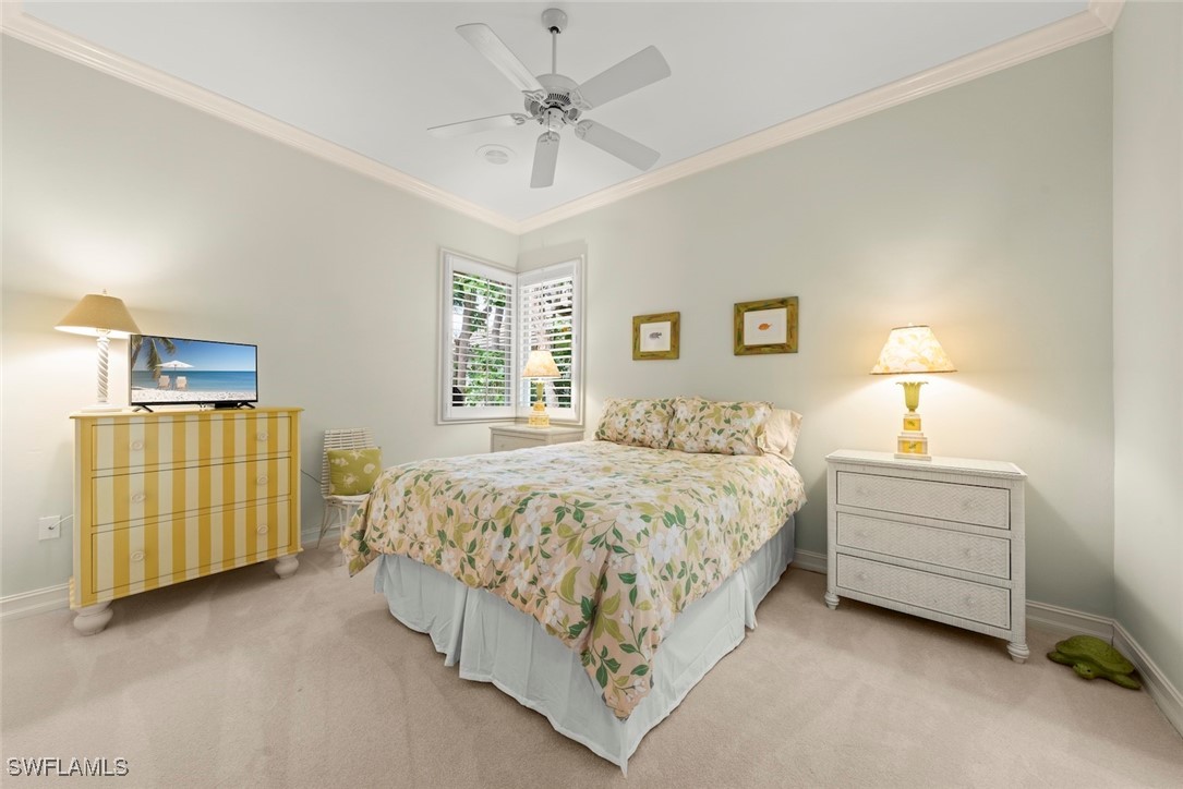 2337 Wulfert Road Sanibel, FL 33957 - Photo 30 of 45 a spacious bedroom with a bed and dresser