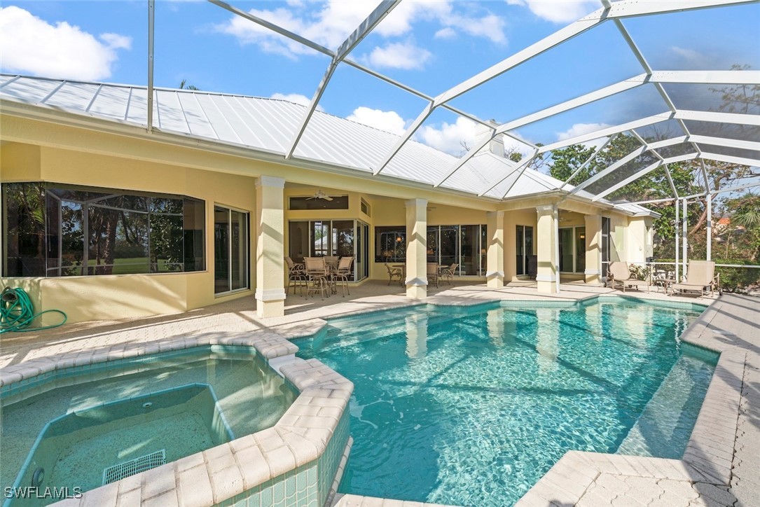 2337 Wulfert Road Sanibel, FL 33957 - Photo 34 of 45 a swimming pool with outdoor seating