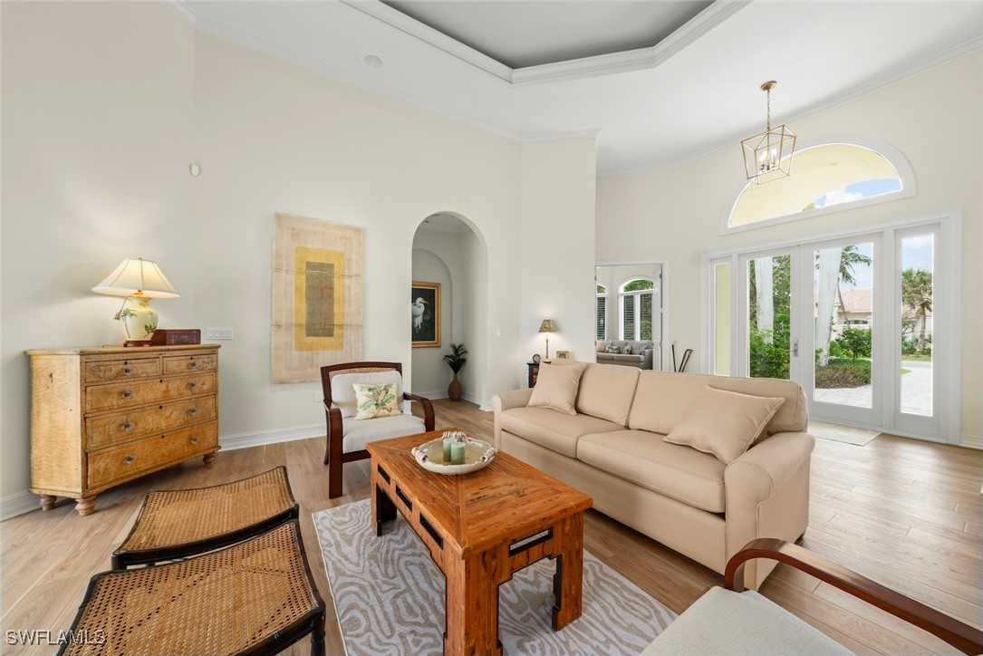 2337 Wulfert Road Sanibel, FL 33957 - Photo 5 of 45 a living room with furniture and a chandelier