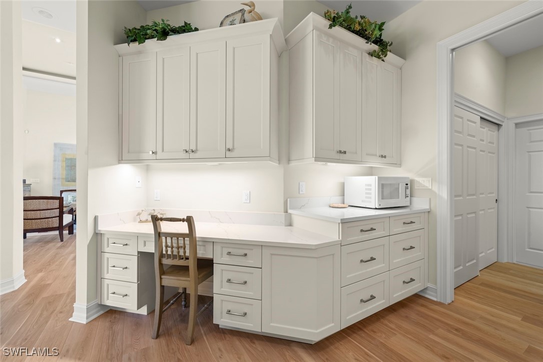 2337 Wulfert Road Sanibel, FL 33957 - Photo 9 of 45 a kitchen with cabinets and window